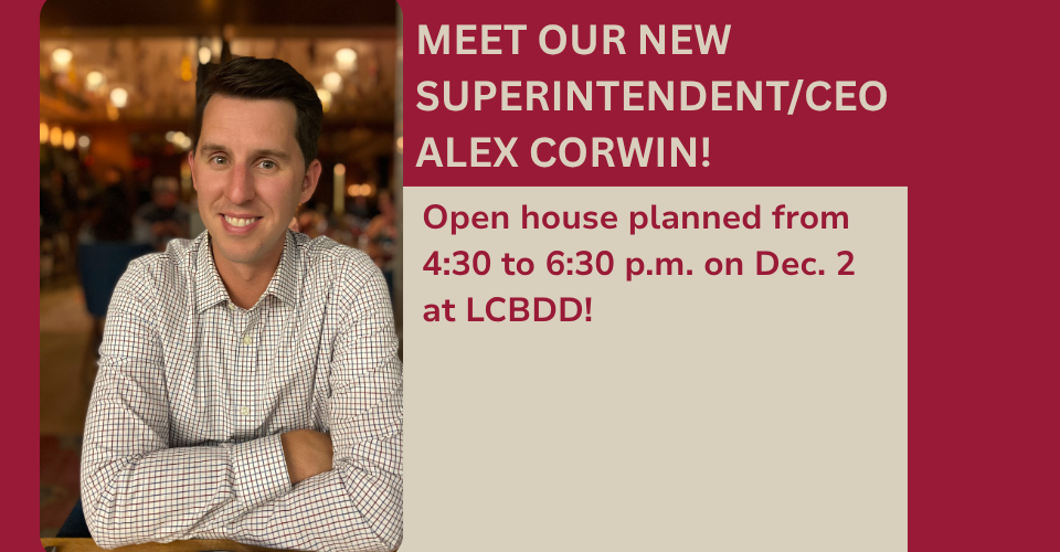 A decorative website banner featuring a headshot of Alex Corwin, a man with dark hair wearing a beige shirt.