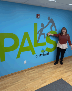 A photo of a DSP standing in front of the PALS logo.